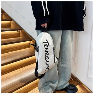 Detailed view of white waterproof crossbody bag with black TENRGUN letters on model