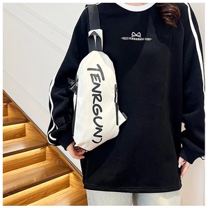 Close-up of white unisex nylon chest bag with black TENRGUN print and adjustable strap