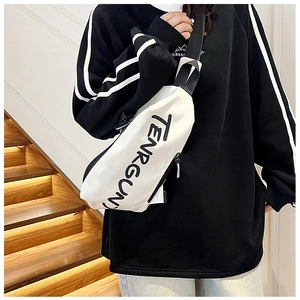 Close-up of white canvas chest bag with black TENRGUN letter print and nylon strap