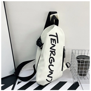 Detail showing white street-style crossbody bag with black Tenrgun letter printing