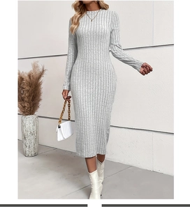 Detail of grey long sleeve ribbed knit dress showing the slim fit texture and round neck