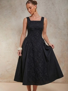 Elegant black sleeveless midi dress featuring sophisticated 3D floral embroidery details