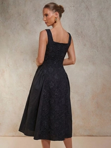 Elegant black midi dress with floral relief embroidery and square neckline design