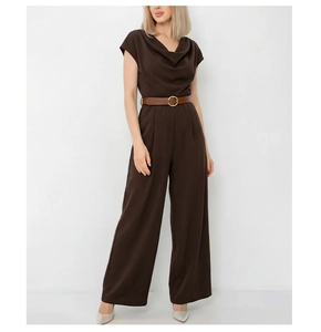 Detail of dark brown satin jumpsuit featuring cowl neck and slim belt with gold buckle