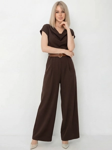 Close-up of elegant coffee satin jumpsuit with cowl neck and matching leather belt