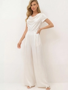 Detail view of the draped cowl neck and satin fabric texture on this elegant jumpsuit
