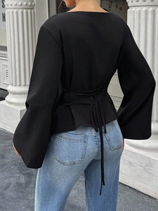 Women's black backless long sleeve shirt with flare sleeves and lace-up waist design