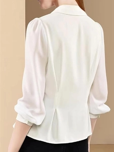 Back view of a white satin long sleeve shirt with cinched waist and pleated details
