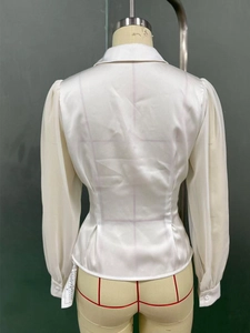 Rear view of white satin blouse showing waist tailoring and sheer sleeve details