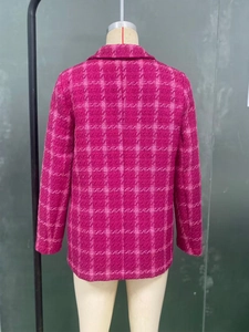Detailed back view of magenta plaid tweed coat showing texture and tailored fit