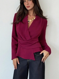 Elegant deep burgundy long sleeve wrap top with V-neckline and waist draping details