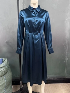 Detail of navy satin long sleeve dress with button-down front and elegant shirt collar