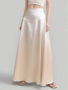 Detail of elegant satin maxi skirt showing high waist V-seam and silky texture