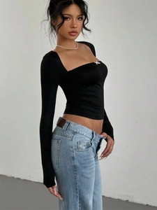 Slim fit black long sleeve crop top with sweetheart neck and pink bow detail