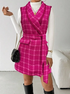 Elegant rose pink tweed vest dress with a notched lapel and matching waist belt