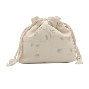 Chic cream mini bucket bag with floral embroidery and cotton drawstring closure