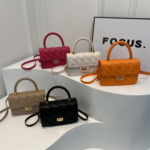 Minimalist square crossbody bag with quilted texture and woven handle in five colors
