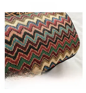 Macro shot of colorful chevron woven pattern and edge stitching detail on the handbag