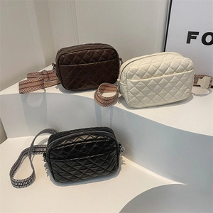 Quilted crossbody bags in black, white, and brown with vintage wide jacquard straps