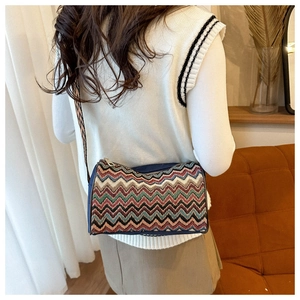 Close-up of colorful ethnic zigzag pattern crossbody bag with wide shoulder strap
