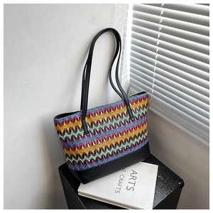 Fashionable woven colorful tote bag with wavy patterns and black PU leather handles
