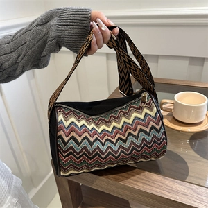 Ethnic bohemian crossbody bag with colorful zigzag patterns and a wide shoulder strap