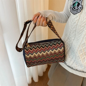 Ethnic striped crossbody bag with wide shoulder strap and colorful wavy woven texture