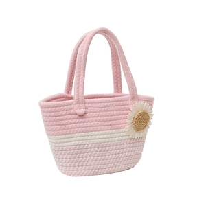 Pink and white woven tote bag with daisy ornament for beach and summer travel