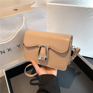 Chic beige crossbody square bag with unique silver buckle and leather strap for women