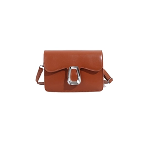 Brown leather crossbody bag with wavy flap design and silver trapezoid metal buckle