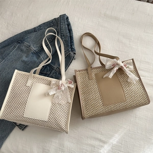 Straw tote bags in ivory and khaki with hollow mesh weave and silk scarf accent