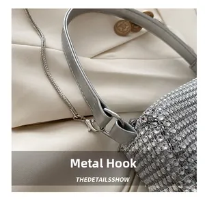 Detailed macro view of silver leather strap with metal hook and rhinestone craft