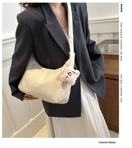 Chic cream white PU leather crescent bag with a cute pink plush bear pendant on strap