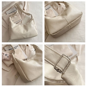 Detail shots of off-white wrinkled leather tote with silver buckle and adjustable strap