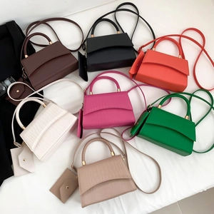 Mini crocodile pattern crossbody bags in seven colors with matching mini pouches