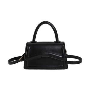 Minimalist black square handbag for women with curved stitch detail and top handle