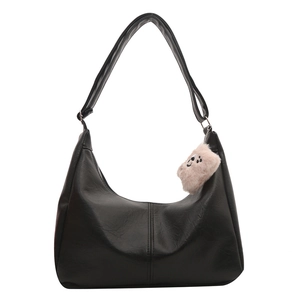 Large black faux leather hobo tote bag with a pink plush bear charm and stitch detail