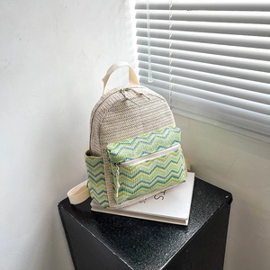 Ethnic straw backpack with colorful chevron pattern and dual zippers for summer leisure