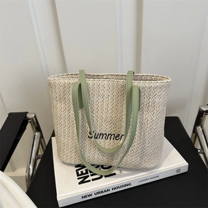 Large woven straw tote bag with Summer embroidery and green handles for summer vacation