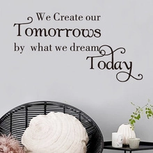 Detail of black PVC wall decal with motivational quote We Create our Tomorrows by what we dream Today