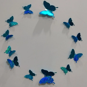 Detailed view of 12 blue 3D holographic butterfly wall stickers in a circular arrangement