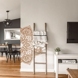 Detailed view of a dark brown lotus mandala wall sticker in a modern living room