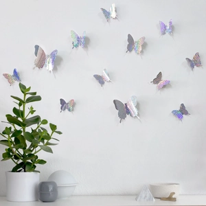 3D holographic butterfly wall stickers on white wall with modern home decor accents