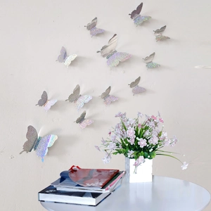 Detailed view of 3D laser holographic butterfly wall stickers on a light neutral wall