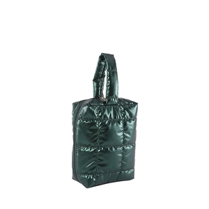 Quilted dark green nylon tote bag with metallic finish and top handle on white background