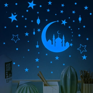 Leuchtende blaue Aufkleber mit Mondsichel und Sternen für die Wand im Kinderzimmer
