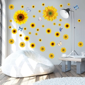 Detailed view of sunflower and butterfly wall decals on a modern minimalist gray wall