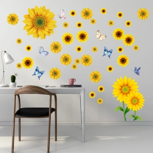 Sunflower and butterfly wall decals displayed on a gray wall in a home office setting