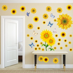 Detail of sunflower and butterfly wall stickers on light beige wall in a cozy room