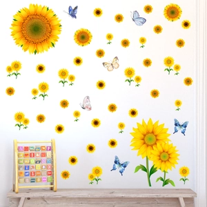 Vibrant sunflower and butterfly wall decals decorating a white living room wall